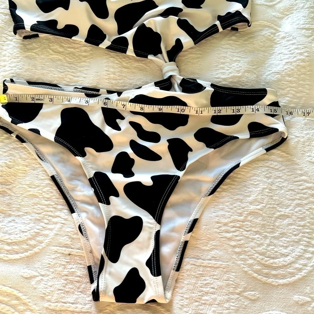 NWOT Black and white asymmetric swimsuit size L.